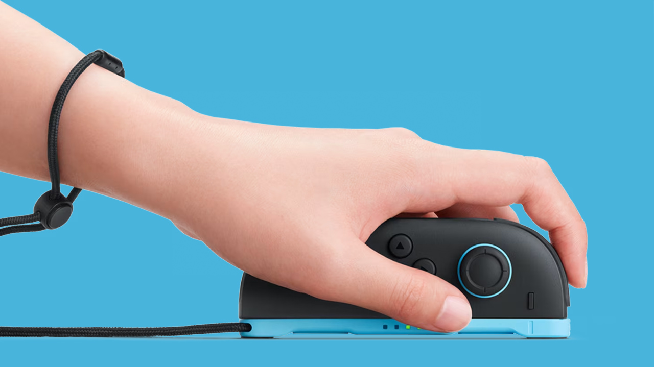 O controle Joy-Con 2 no modo mouse (virado para baixo como um mouse de computador)