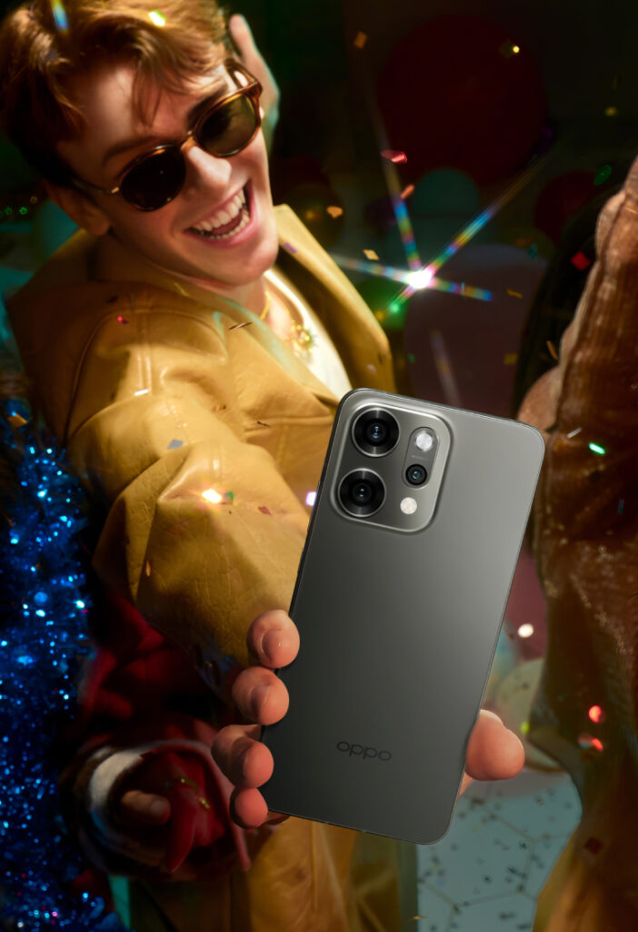 Oppo Reno 14 Pro 5G na cor cinza é usado por um homem para tirar fotos em uma festa