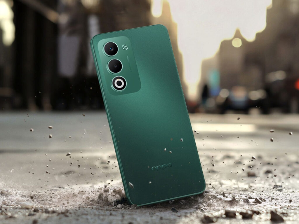 Oppo A5 5G na cor verde em um cenário com o chão trincado para mostrar sua resistência a quedas